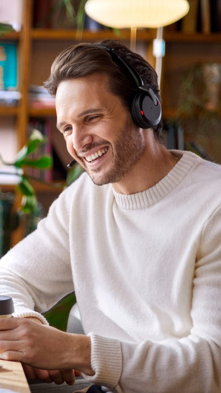 Professional user with Jabra Evolve2 65 Flex headset during hybrid working in video call