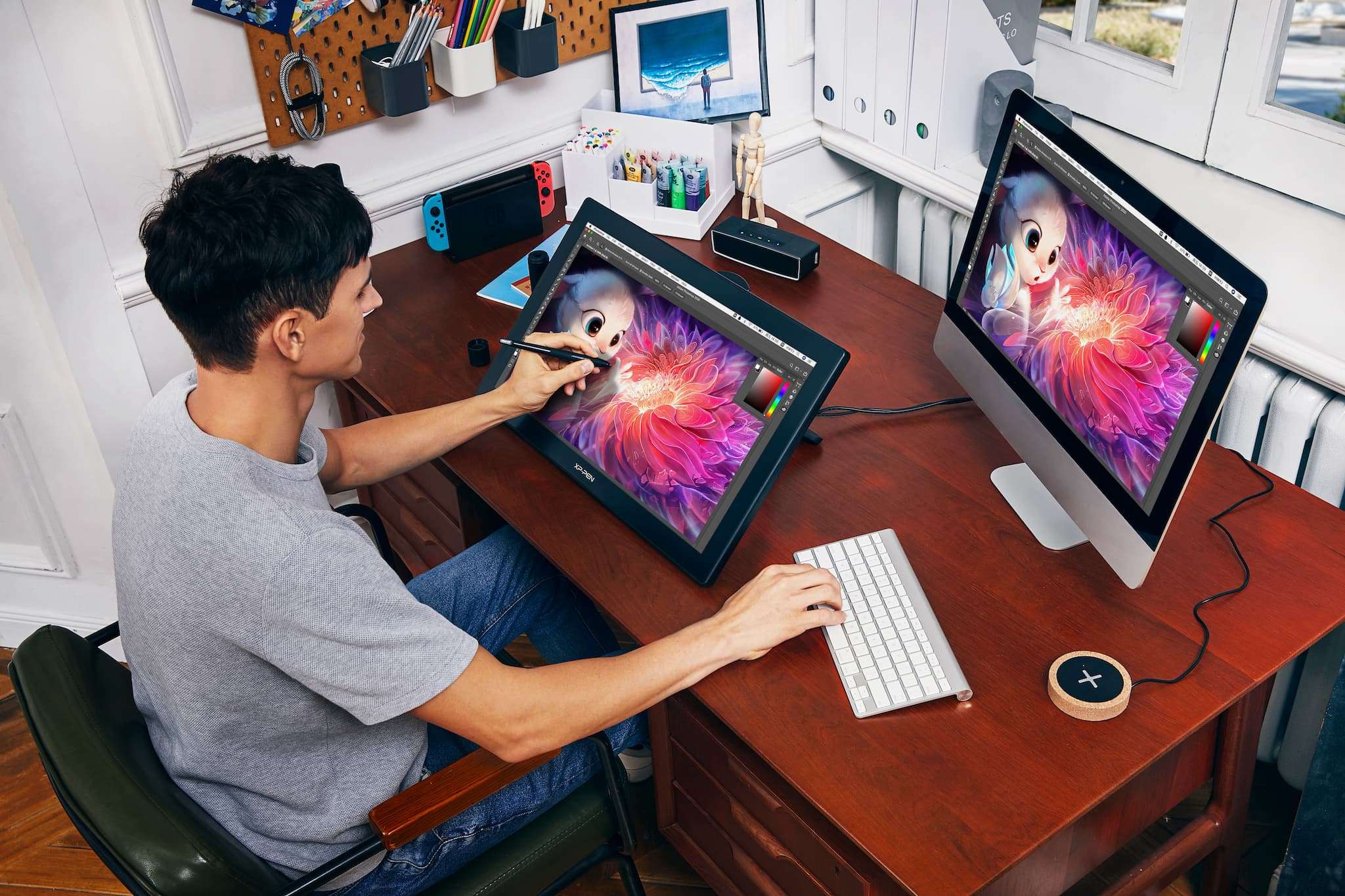 Graphic designer using a drawing tablet to sharpen design. Source: https://discover.therookies.co/2021/06/02/why-every-digital-artist-should-own-a-graphics-tablet-or-pen-display-monitor/