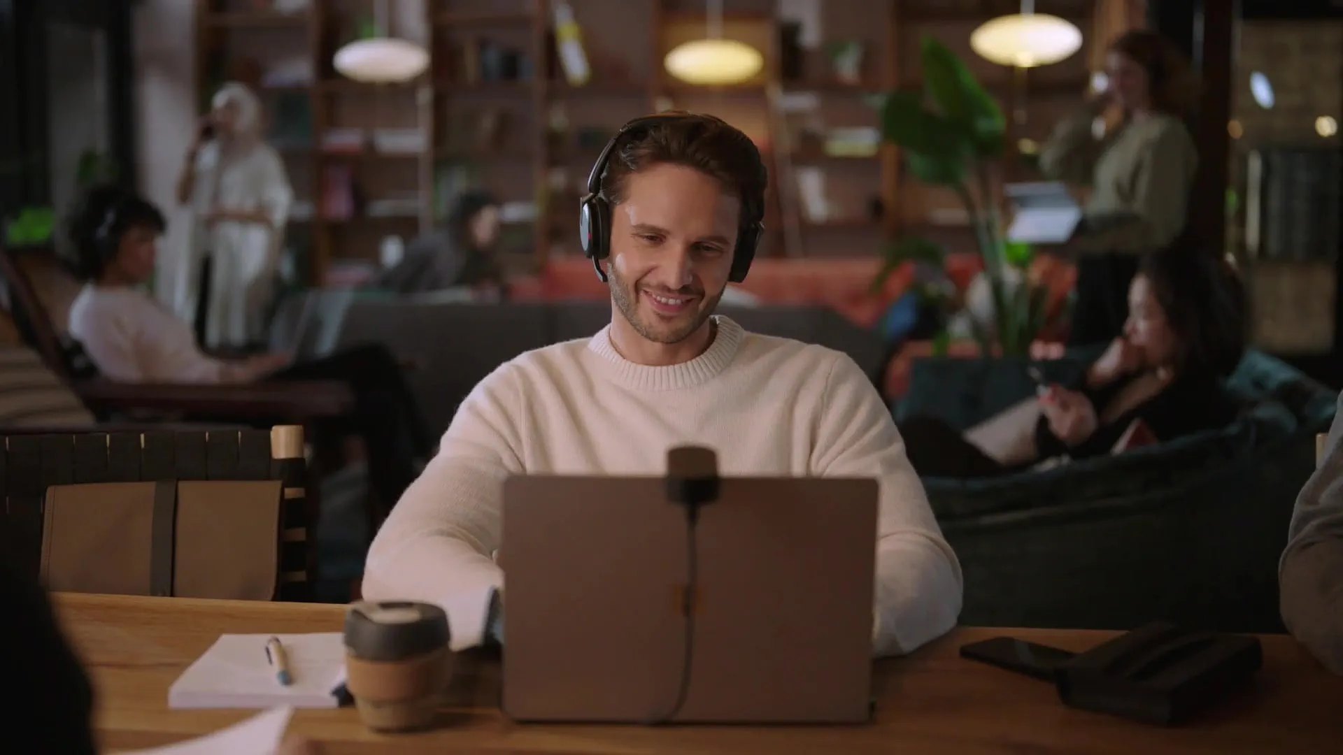 Man with Jabra Evolve2 65 Flex headset videoconference