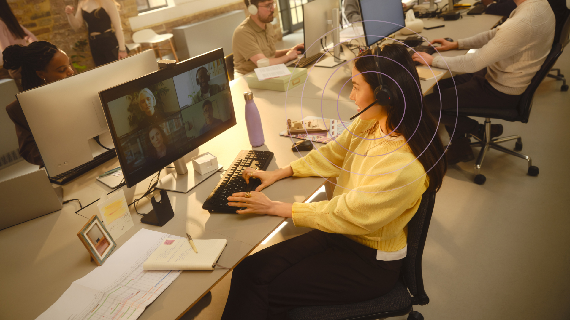 Person using Jabra Evolve3 45 headset during a video call in an office setting